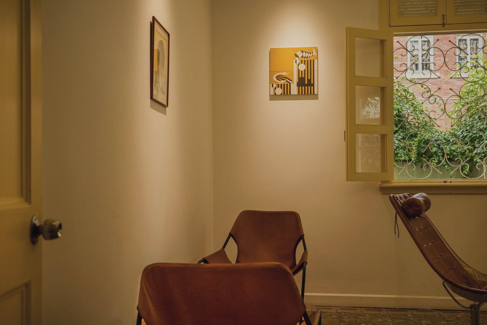 Empty room with a chair beside a window, illustrative image